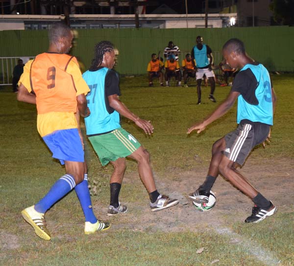 Part of the action between Old School Ballers and Cross Street on Monday.