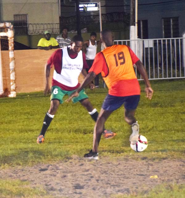 A player from Globe Yard (backing camera) on the attack in their clash against Bent Street.