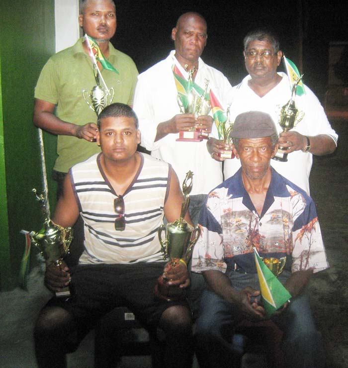 The outstanding Draughts performers of the Trophy Stall Jubilee tournament: (sitting; right) Ulric Braithwaite and Khemraj Pooranmall; (back; from right) Jiaram, Steve Bacchus and Navin Megbarran.