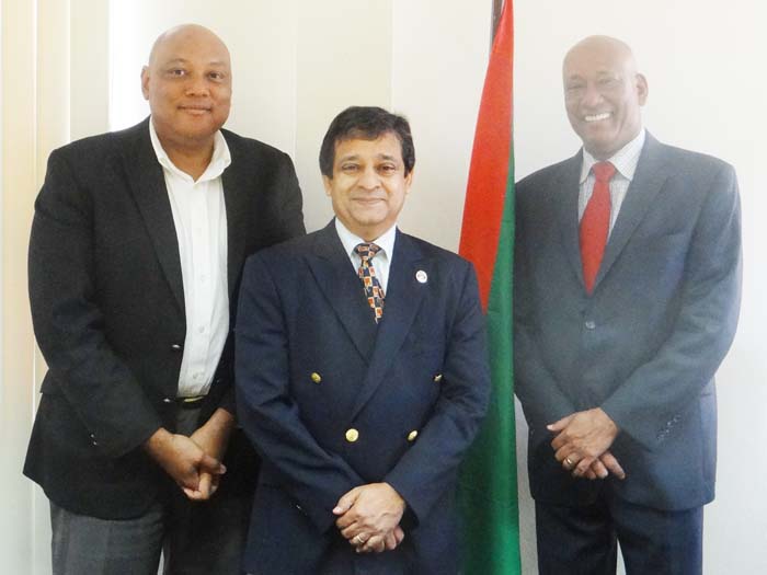 Minister Raphael Trotman (l) meets with new ambassadors, Riyad Insanally and Bayney Karran 