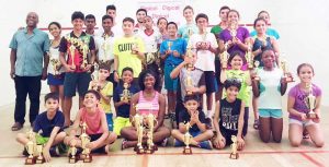 Woodpecker Products 2016 Squash champs pose with their trophies following the presentation. Coach Carl Ince is at left (standing). 