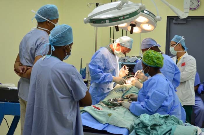  The Chinese Medical Team performing spinal surgery on a patient at the New Amsterdam Hospital.