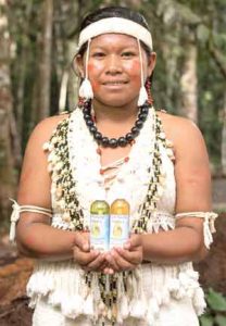 Deltina, a young Musushi woman, showcases two of the Rupununi Essence products