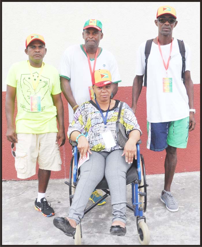 William France (centre) is flanked by Looknauth Perreira (left) and Godfrey Williams, while Yvonne DeAbreu sits in her Wheelchair. 
