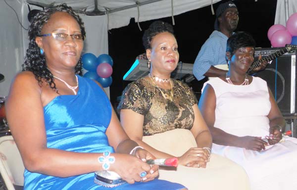 Dianne Moore (blue dress), Sue Rogers (centre) and Lorraine Inniss.