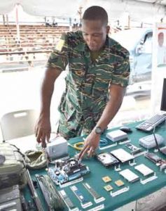 A GDF Sergeant in the  IT section of the GDF Booth