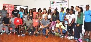 Guyanese and international athletes, who will be competing in the Aliann Pompey Invitational Meet today at Leonora, pose for a photo opportunity after the Press Conference yesterday at the Ramada Princess Hotel.