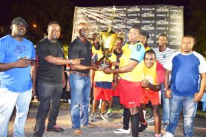 Guinness Brand Manager Lee Baptiste (3rd left) hands over the cash and championship trophy to Captain of BV ‘B’ Erin Fraser in the presence of teammates and Organiser Troy Mendonca (right) on Sunday.