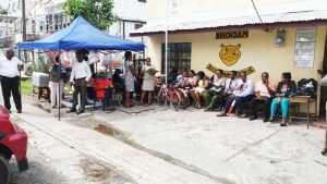 Teachers of Brickdam Secondary sitting outside of the School in protest of the deplorable conditions yesterday morning.