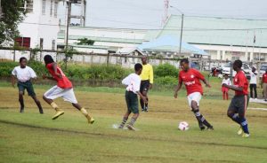 Part of the action between Canje Secondary and Overwinning Secondary in the Digicel Schools Football Championship at Burnham Park in Berbice yesterday.