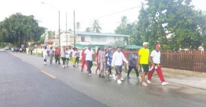  Commander Assistant Commissioner Ian Amsterdam leading the way on the road in the West Coast Berbice fitness activity. 