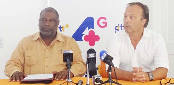 Chief Commercial Officer Gert Post and Permanent Secretary of the Ministry of Public Telecommunications Derek Cummings at GTT’s Press Conference.