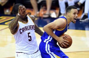Golden State Warriors guard Stephen Curry (30) drives to the basket against Cleveland Cavaliers guard J.R. Smith (5) during the fourth quarter in game four of the NBA Finals at Quicken Loans Arena. (Bob Donnan-USA TODAY Sports)