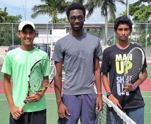 Heimraj Resaul (left), Umpire Jamal Goodluck (centre), Keenan Persaud