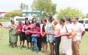 Executive Director of GAIL Foundation, Gail Seeram, cuts the ceremonial ribbon with Minister of Social Protection Volda Lawrence