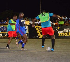 Players battle for possession in one of the quarter-finals of the National Playoffs.