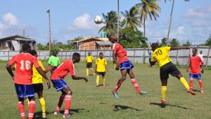 Pouderoyen (red & blue) going head to head in their clash with Jetty Gunners at the Den Amstel ground. Franklin Wilson photo.