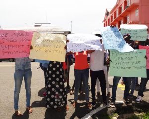 The Group of youths displaying their placards.