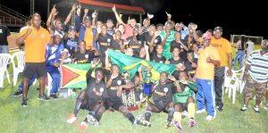 Slingerz Head Coach Joseph 'Bill' Wilson (right)  giving the thumbs as his side  celebrate SEL overall victory on Sunday night last at Leonora.