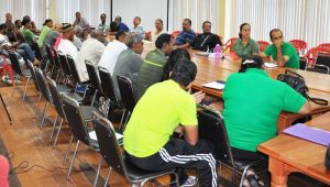 Heads and representatives of sport associations pay keen attention to Minister Henry yesterday during her closing remarks of their meeting.