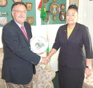 Argentine Ambassador to Guyana, Luis Martino is presented with a painting of City Hall by Mayor Patricia Chase-Green