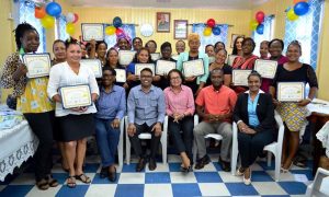 From left: Facilitator, Mr. Yohann Pooran, First Lady, Mrs. Sandra Granger, Mayor of Bartica, Mr. Gifford Marshall, Deputy Mayor, Ms. Kamal Persaud and the 26 participants of the Self Reliance and Success in Business Workshop.
