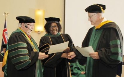 Minister Cummings receives Honorary Doctorate and Professorship from USAT