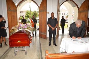 President David Granger signing the book of condolence for the late Mr. Jules Richard Kranenburg at the Cathedral of the Immaculate Conception, Brickdam, Stabroek
