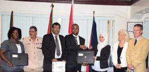  Director of GFSL Delon France receives forensic video analysis equipment and software packages from the Justice Education Society in the presence of Public Security Minister Khemraj Ramjattan and Acting Police Commissioner David Ramnarine.