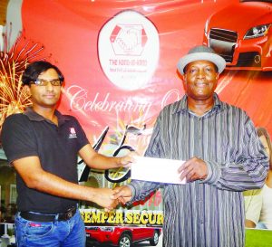 A Representative of the Hand In Hand hands over the Company’s sponsorship to Compton Sancho (right) of the Jumbo Jet. 