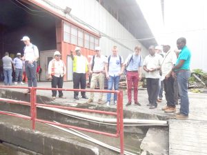 The DRR team, NDIA officials and M&CC officials looking at a sluice on Water Street.