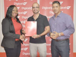 Digicel’s Senior Sponsorship and Events Manager Ms. Louanna Abrams (left) and Evolution Cycle Club (ECC) President, Keith Fernandes, exchange pleasantries following the inking of the agreement. At right is Club Secretary, Andrew Arjoon. 