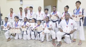 Proud Moment! Members of the Guyana ASK-G (YMCA and Land of Canaan) and GKC display their medals and certificates won at the 12thInternational Karate Daigaku (IKD) Caribbean Karate Championship in Jamaica. 