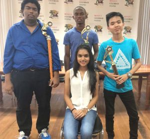 CM Taffin Khan, CM Anthony Drayton and HaiFeng Su show off their winnings in the company of Andrew Arts representative, Reigning Miss Guyana Talented Teen, Reesa Sooklall