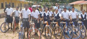 Some of the recipients display their brand new bicycles, which were donated under President David Granger’s ‘Five Bs’ or ‘Boats, Buses, Bicycles plus Breakfast and Books’ Programme.