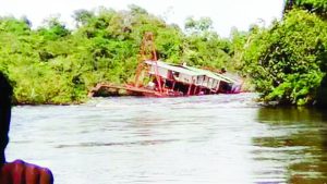 The sunken dredge in the Mazaruni River. 