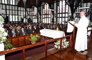 President David Granger, Prime Minister, Mr. Moses Nagamootoo and  Speaker of the National Assembly, Dr. Barton Scotland are seated in the  front pew at the funeral service for the late Bishop Randolph George 