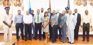 Minister of Public Security Khemraj Ramjattan,  United States Ambassador, Perry Holloway with trainers and participants.