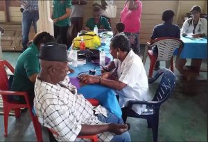 Persons being attended to at  Friday's Health Fair