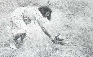 Shirley Reece lays flowers at her daughter’s grave
