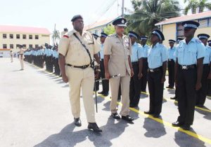 The Commissioner of Police and the new recruits.