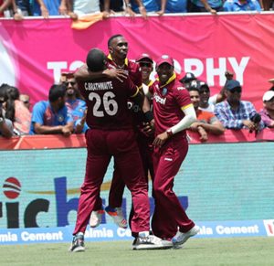 Dwayne Bravo exults with his team-mates after West Indies' one-run win, India v West Indies, 1st T20I, Florida, August 27, 2016 ©BCCI