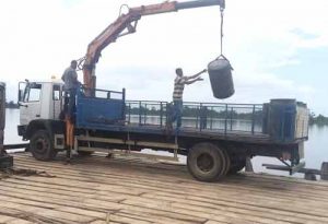 GEA officials offloading the illegal fuel that was seized at Airy Hall, on the Essequibo Coast