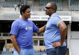 India coach Anil Kumble and West Indies coach Phil Simmons are engaged in conversation. ©Associated Press