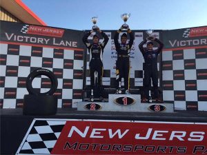 Calvin Ming stands atop the podium with 2nd placed teammate Phillippe Denes (left) and 3rd place Neil Verhagen of K-Hill Motorsports. (Calvin Ming’s Facebook)