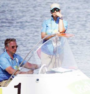 Race officials stand by in a boat shortly after competition was postponed due to high winds in the Men’s Single Sculls Repechages at Lagoa Stadium. (REUTERS/CARLOS BARRIA)