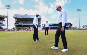 The umpires inspect the outfield at Queen’s Park Oval, West Indies v India, 4th Test, Port of Spain, 2nd day, August 19, 2016 ©AFP