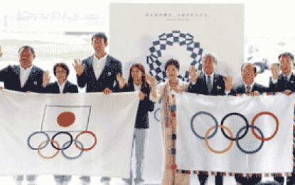 Olympic flag arrives in Tokyo, governor calls for unity