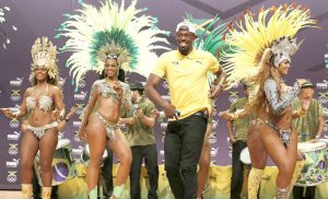 Usain Bolt enjoys a moment with the Samba dancers in Brazil.