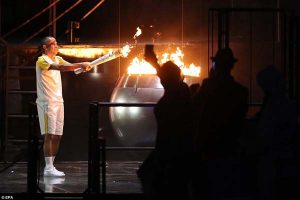 Vanderlei Cordeiro de Lima lights the Olympic flame to bring the Opening Ceremony of the Rio 2016 Olympic Games to an end.